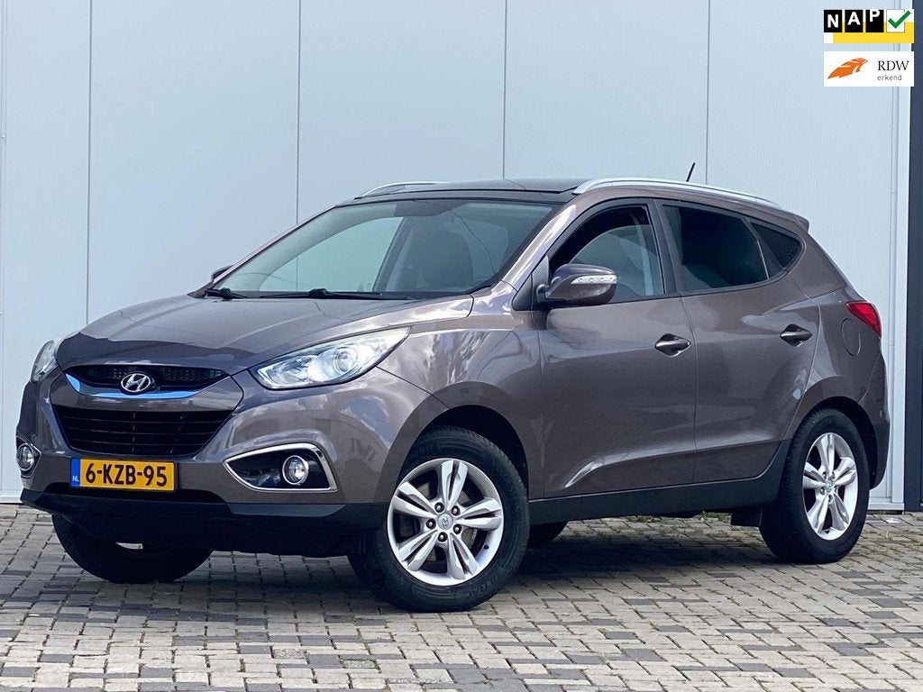Hyundai Ix35 DUBBELE PANORAMADAK NAVI DEALER ONDERHOUD 2.0i, Auto's, Hyundai, Gebruikt, 4 cilinders, Bruin, Leder en Stof