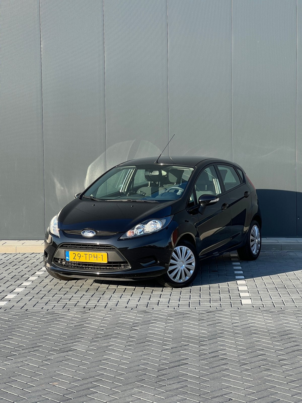 Ford Fiësta 1.25 44KW 5DR 2012 Zwart, Auto's, Voorwielaandrijving, Stof, 40 €/maand, 4 cilinders