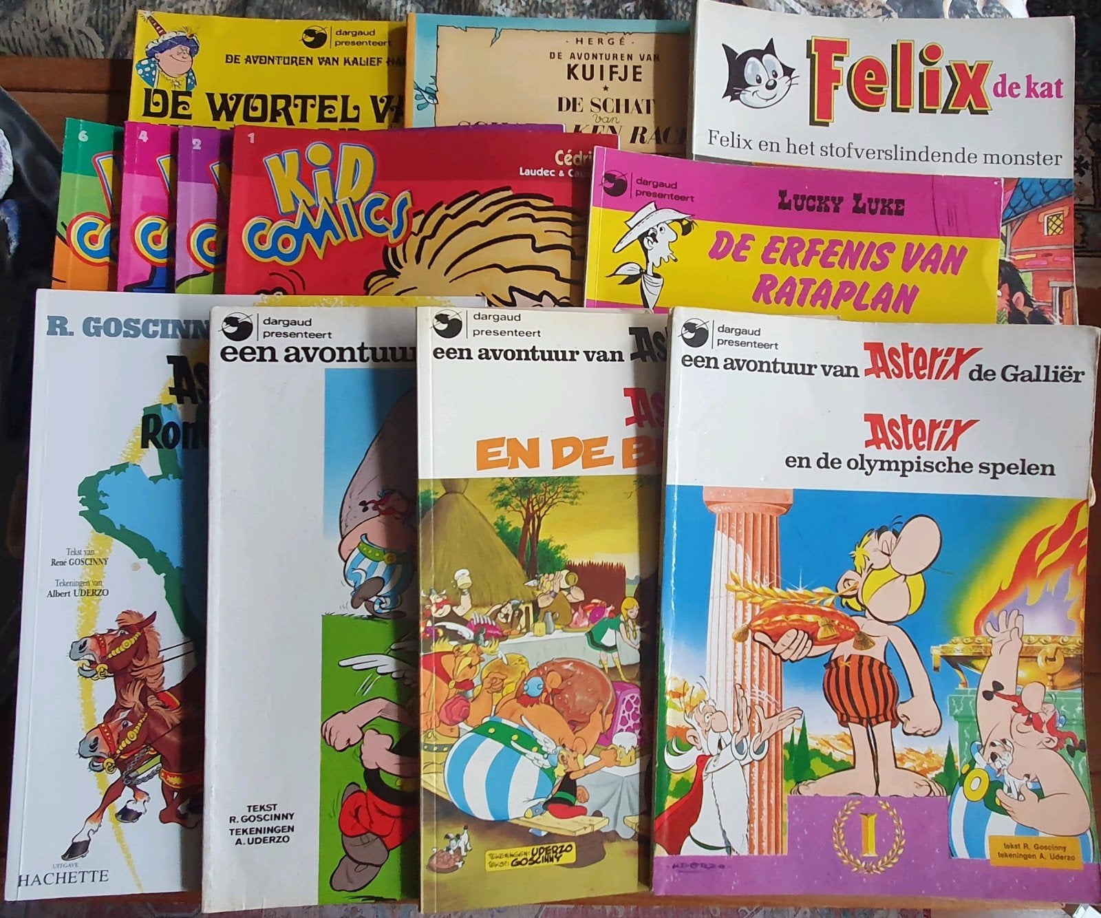 12 stripboeken: Asterix, Lucky Luke, Kuifje, Felix de Kat, Boeken, Meerdere stripboeken, Ophalen of Verzenden, Gelezen