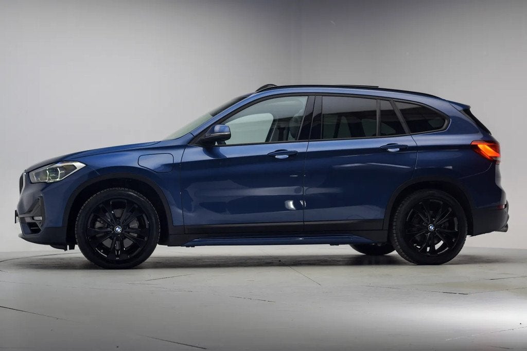 BMW X1 xDrive25e High Executive Sport Aut. [ Panorama Trekha, Auto's, 125 pk, Gebruikt, 750 kg, Blauw