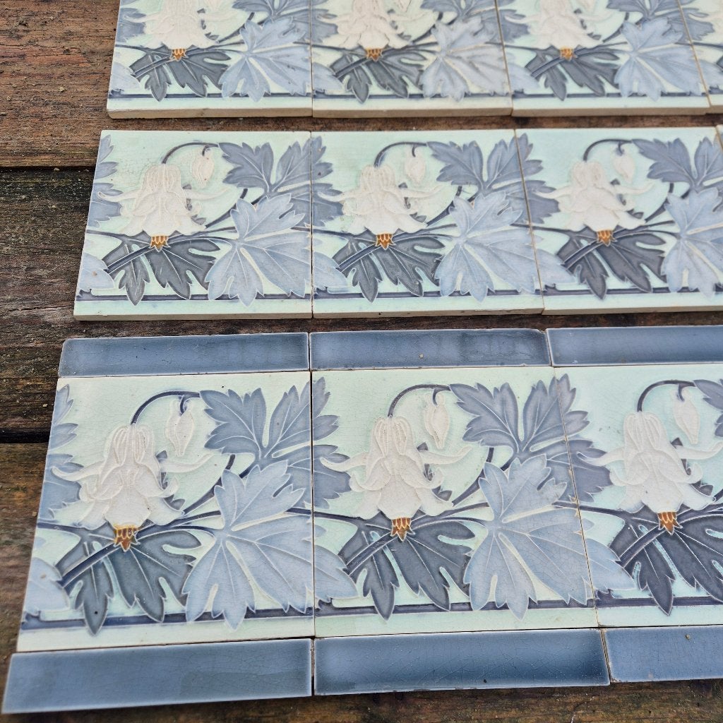 33 art nouveau randtegels in grijs/wit tinten opgelegd decor