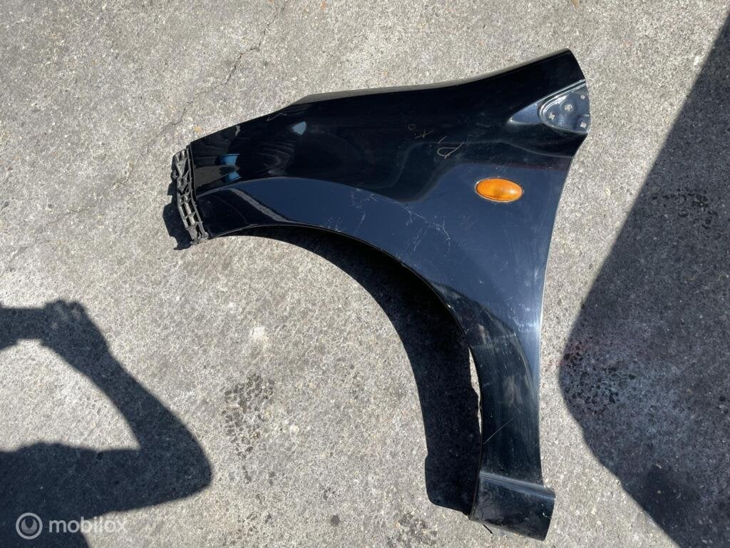 Linker spatbord links zwart Nissan Pixo ('09-'14), Auto-onderdelen, Gebruikt, Ophalen of Verzenden, Nissan, Nissan