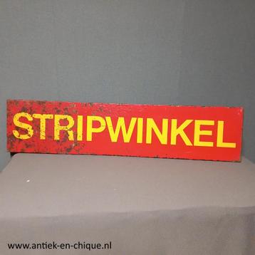 Reclamebord van een stripwinkel beschikbaar voor biedingen