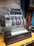 Antieke kassa National uit 1913 gerestaureerd, Ophalen