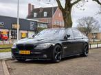 BMW 7-Serie 4.4 I 750 AUT 2009 Zwart, Auto's, Automaat, Euro 5, Achterwielaandrijving, USB
