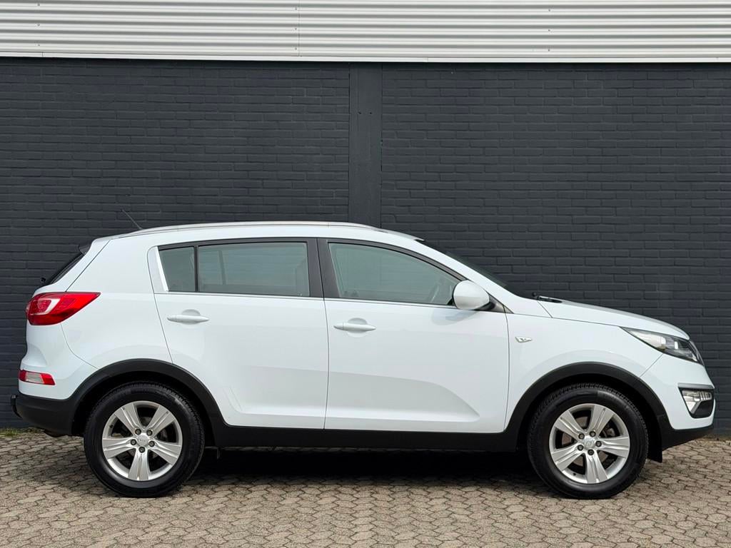 Kia Sportage 1.6 GDI ComfortLine AIRCO CRUISE TREKHAAK WINTE, Auto's, Kia, Voorwielaandrijving, Euro 5, 4 cilinders, Wit