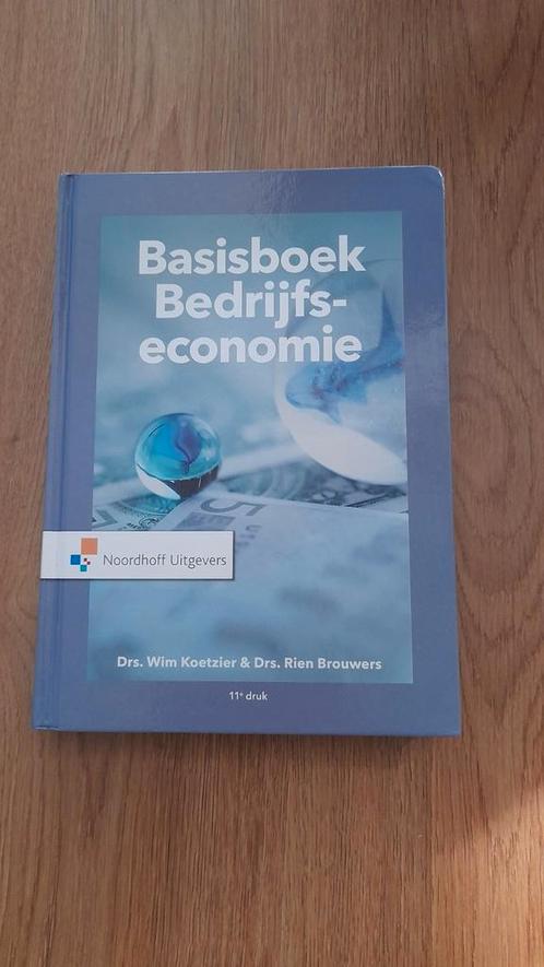 Basisboek Bedrijfseconomie + opgaven en uitwerkingen, Boeken, Economie, Management en Marketing, Zo goed als nieuw, Economie en Marketing