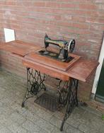 Antieke trap naaimachine Singer, Ophalen