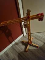 Houten speelgoed hijskraan, Ophalen