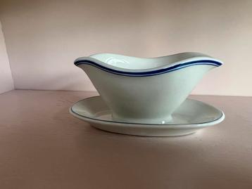 Kleine sauskom wit met blauwe rand beschikbaar voor biedingen