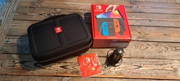 Nieuwstaat: Nintendo switch OLED red/blue met game + extra's beschikbaar voor biedingen