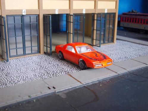 1982 Pontiac Firebird - oranje, Hobby en Vrije tijd, Modelauto's | Overige schalen, Gebruikt, Ophalen of Verzenden