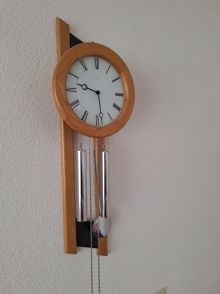 Weer geheel bij de tijd, Ophalen, Wandklok