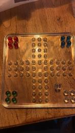 Glazen mens-erger-je-niet spel, Ophalen