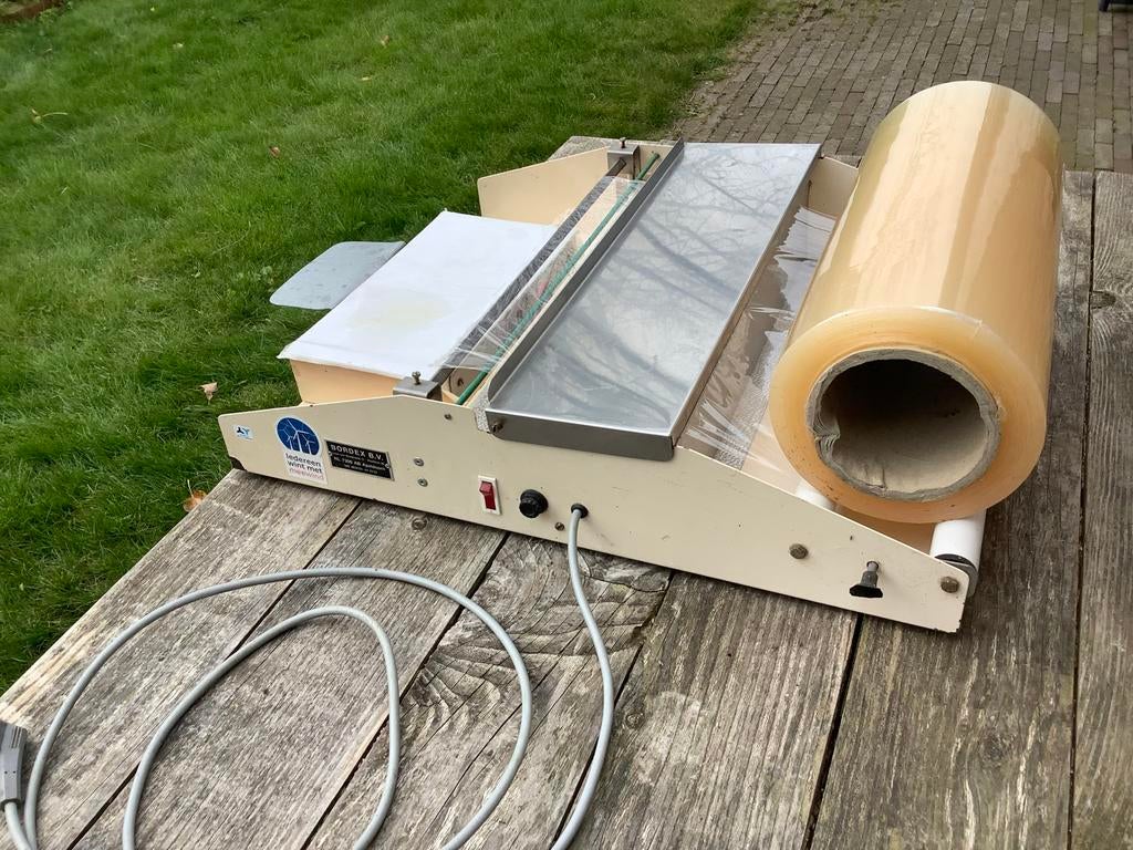 Foliewikkelaar voor Voedselverpakking, Ophalen