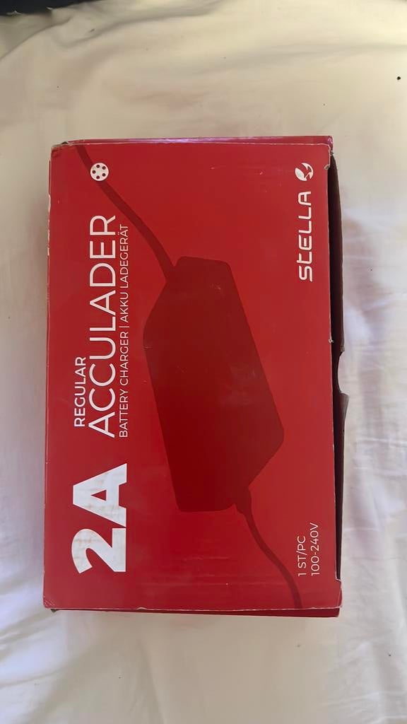 Stella regular accu oplader, Fietsen en Brommers, Fietsaccessoires | Fietsaccu's, Ophalen, Zo goed als nieuw