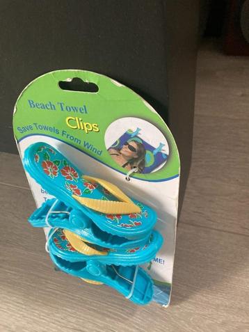 Strandlaken clips in de vorm van teenslippers beschikbaar voor biedingen