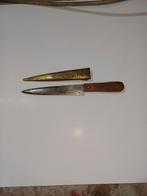 Antieke dolk met geëtste schede en handvat, Ophalen