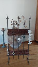 Gietijzeren rek met wilgentenen, Ophalen