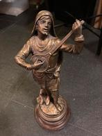 Bronzen beeld muzikant, Ophalen