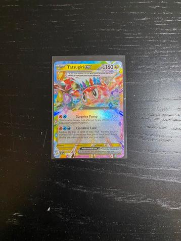 Tatsugiri ex #142/191 - surging spark beschikbaar voor biedingen