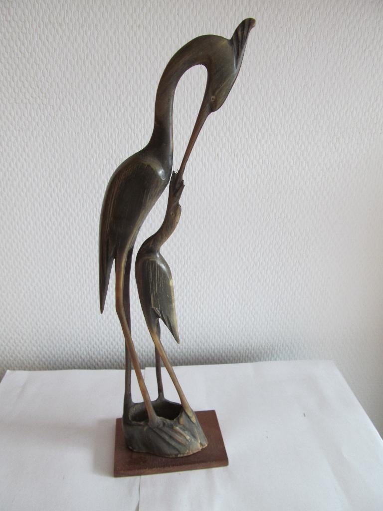 Vintage reiger met jong uit hoorn., Ophalen