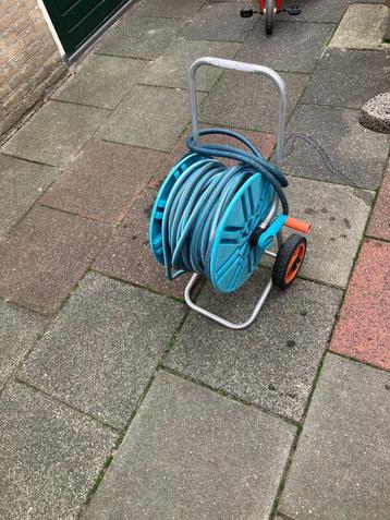 Gardena slanghaspel met Gardena slang + stuk naar de kraan. beschikbaar voor biedingen