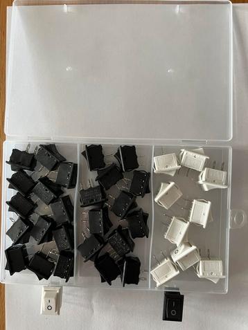 Tuimel/drukschakelaars; aan/uit (SPST) kleuren zwart en wit. beschikbaar voor biedingen