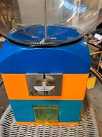 Capsule automaat Caram-Bola, Ophalen