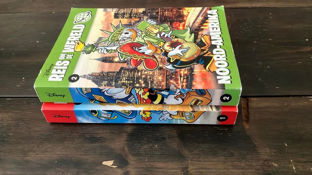 Donald Duck pockets reis om de wereld 2 delen, Boeken, Stripboeken, Meerdere stripboeken, Ophalen of Verzenden, Zo goed als nieuw