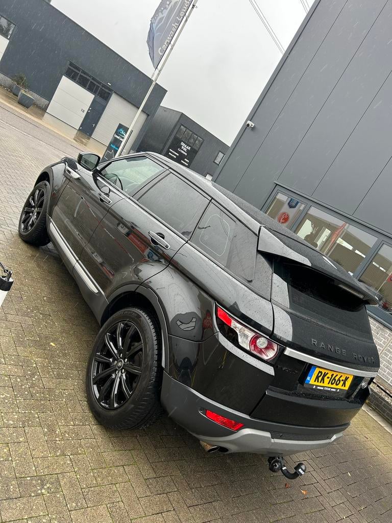Land Rover Range Rover Evoque 2.0 SI4 4WD AUT 2014 Zwart, Auto's, 1800 kg, 4 cilinders, Zwart, Leder