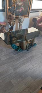 Bronzen dame salontafel, Ophalen