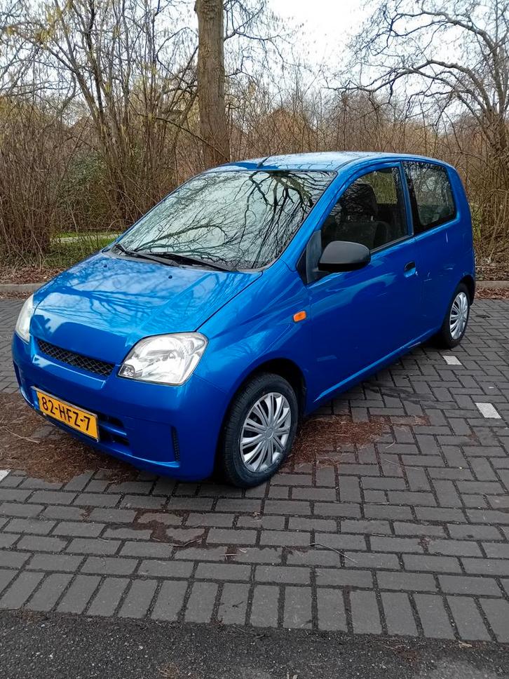 Te koop daihatsu cuore 11-2008 met NAP, Auto's, Daihatsu, Particulier, Metallic lak, Radio, Startonderbreker, Benzine, Hatchback