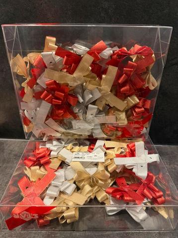 Strikken met plakker zilver, goud en rood 10 cm beschikbaar voor biedingen