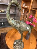 Bronzen Kraanvogel Beeld, Ophalen