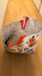 Tas met merk tweedehands kleding, Ophalen