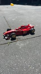 Ferrari f310B, Hobby en Vrije tijd, Modelauto's | 1:24, Ophalen of Verzenden, Zo goed als nieuw, Bburago