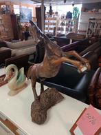 Houten paardenbeeld, Ophalen