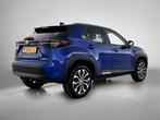 Toyota Yaris Cross 1.5 Hybrid 115 Dynamic (bj 2024), Auto's, 12 maanden, Stof, Gebruikt, Blauw