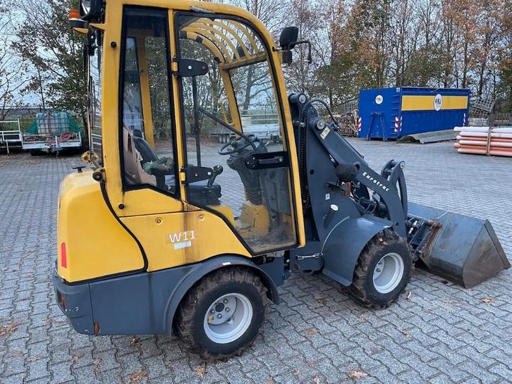 minishovel eurotrac w11 met grondbak en palletvorken, Zakelijke goederen, Machines en Bouw | Kranen en Graafmachines, Wiellader of Shovel
