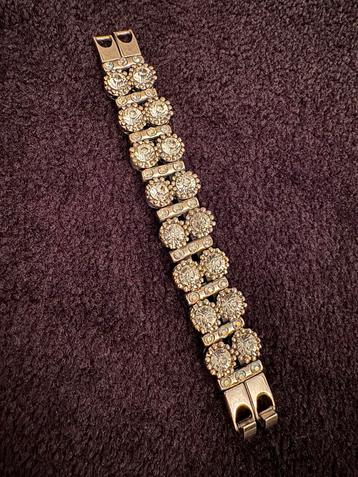 Zilver kleurige armband met strass beschikbaar voor biedingen