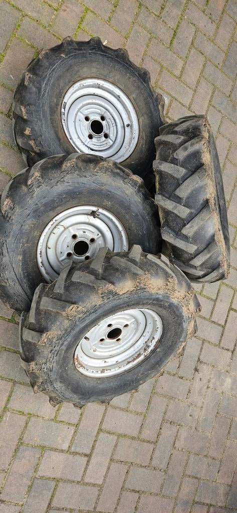 Vier shovel banden met velgen, Ophalen of Verzenden