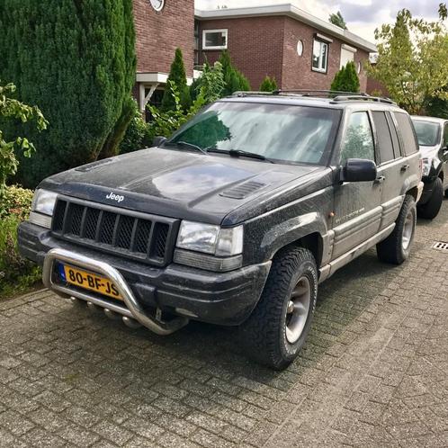 Te Koop: Jeep Grand Cherokee 5.9I V8 1998 grijs kenteken, Auto's, Bestelauto's, Particulier, 4x4, ABS, Airbags, Airconditioning