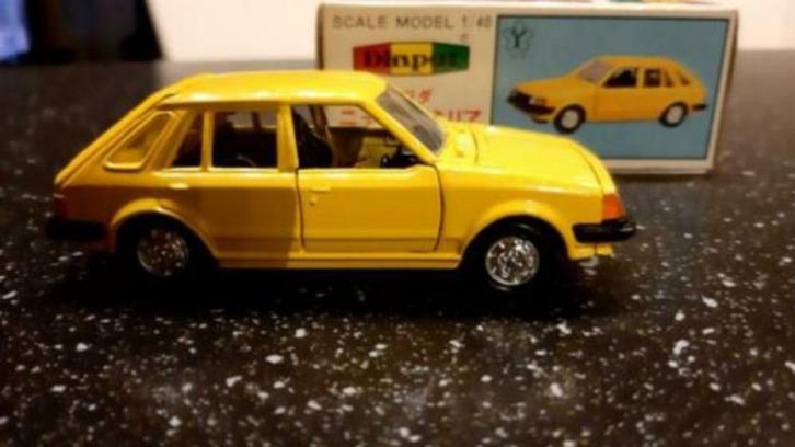 Diapet MAZDA 323 NEW FAMILIA geel yellow YONEZAWA G - 141, Hobby en Vrije tijd, Modelauto's | 1:43, Nieuw, Auto, Overige merken