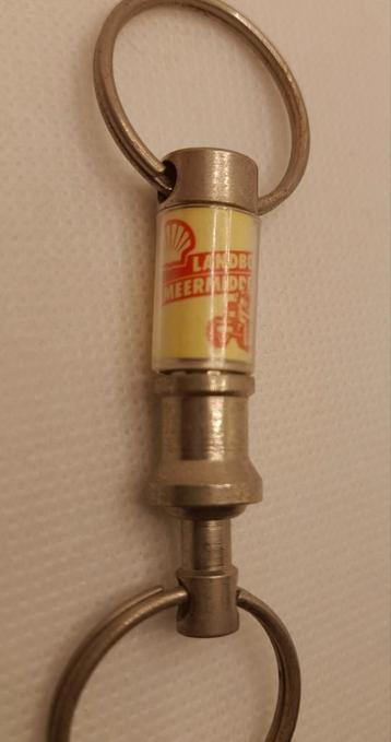 Mooie vintage sleutelhanger Shell Landbouw smeermiddelen  beschikbaar voor biedingen