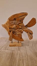 Vis gemaakt van teakhout, Ophalen