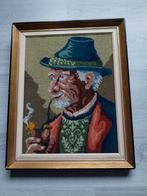 Geborduurd kunstwerk van een oudere man, Ophalen