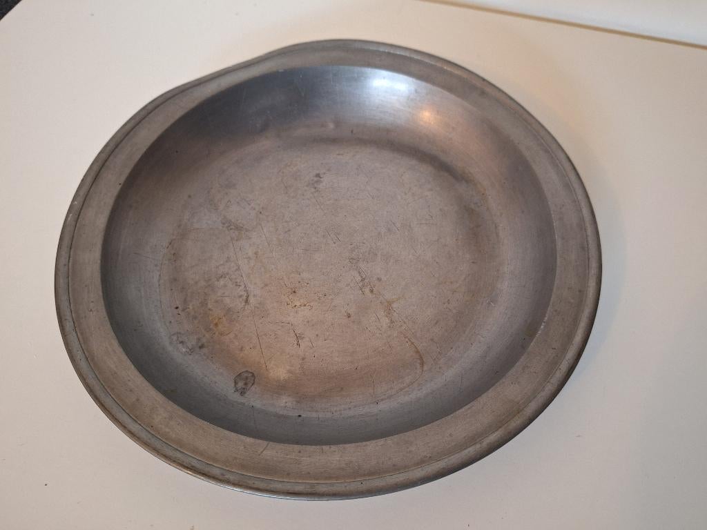 Tinnen bord, Ophalen