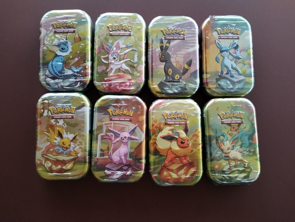 Pokémon prismatic Evolutions Mini Tins (8 stuks), Ophalen of Verzenden, Nieuw, Boosterbox