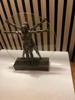 Vitruviusman Sculptuur met Glazen Cirkel, Ophalen
